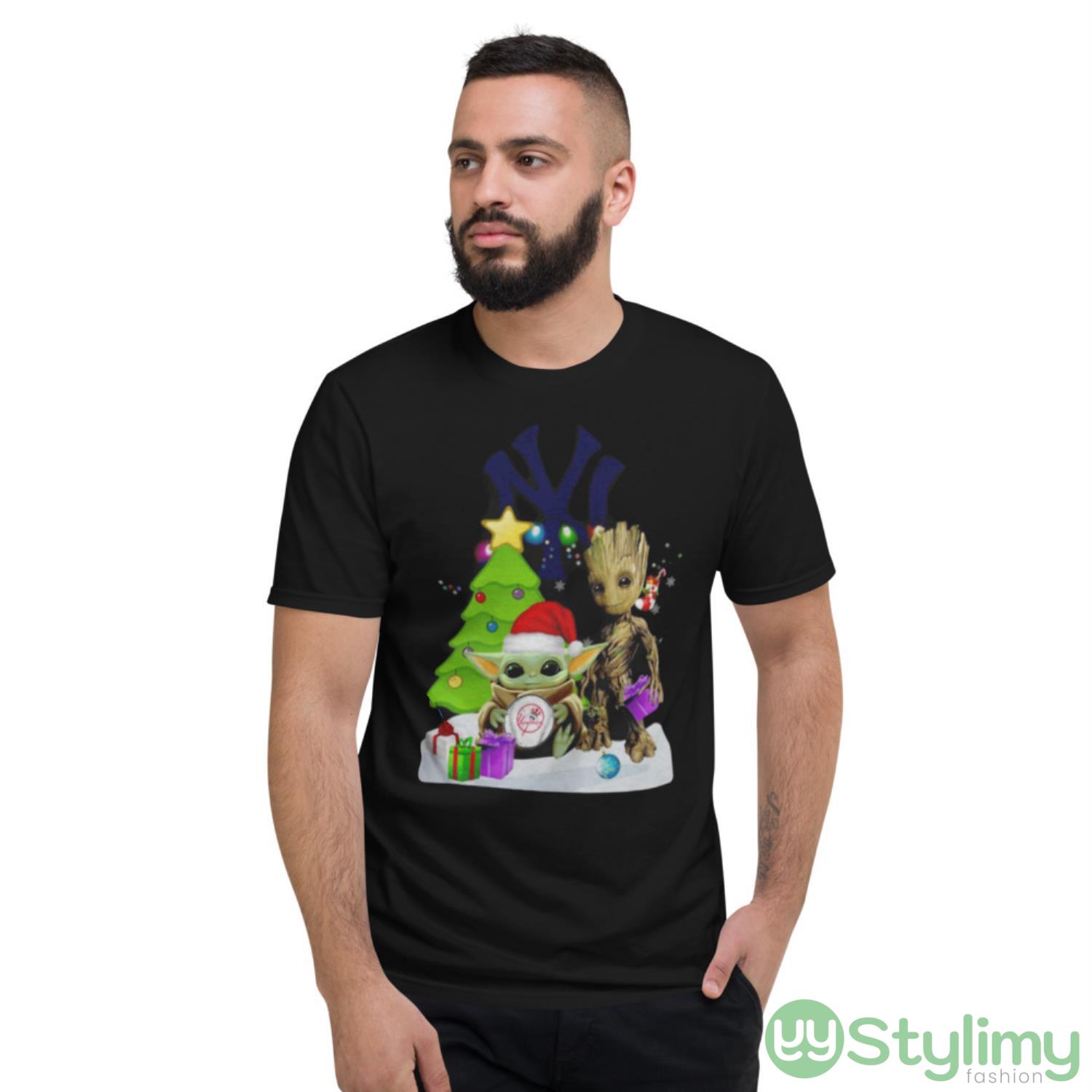 Santa Bigfoot And Baby Yoda Hug New York Yankees Snow Christmas Tree Shirt 2 Santa Bigfoot And Baby Yoda Hug New York Yankees Snow Christmas Tree Shirt - Short Sleeve T-Shirt
