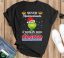 Official Santa Grinch Never Underestimate A Woman Who Works At Costco Wholesale Christmas Shirt - Black Unisex T-Shirt